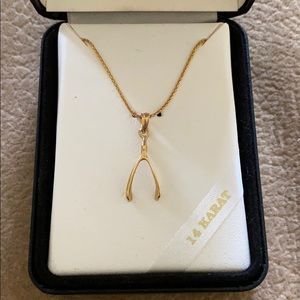 14k gold wishbone necklace, new in box.